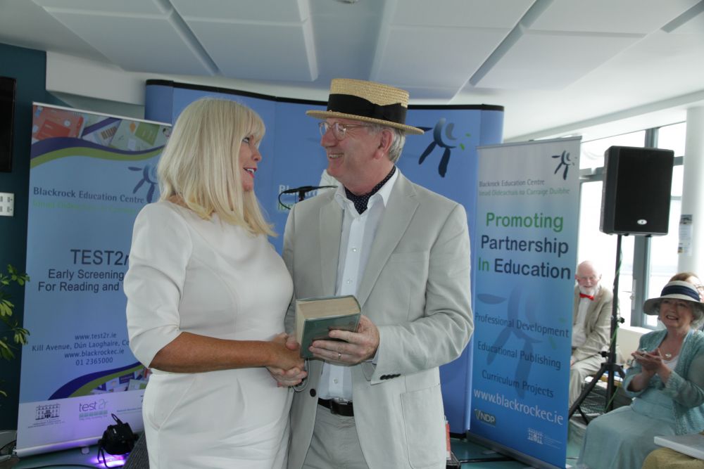 Dr Seamus O'Canainn making a presentation of Ulysses to Minister Mary Mitchell O'Connor TD
